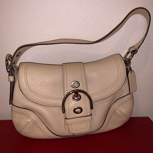 almond color coach leather shoulder bag.